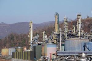 oil refinery smoking chimney detail photo