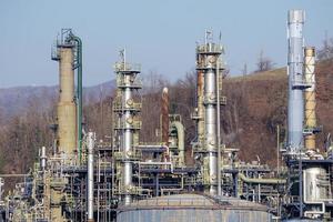 oil refinery smoking chimney detail photo