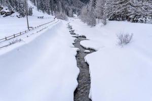 snow hiking forest panorama landscape mountains of Santa Caterina valfurva italian Alps in winter photo