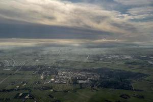 fog and clouds amsterdam area aerial view photo