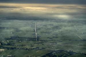fog and clouds amsterdam area aerial view photo