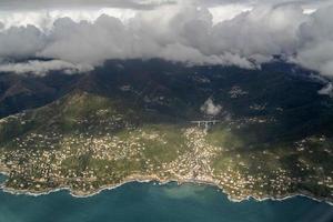 Recco village genoa aerial view before landing on cloudy day photo