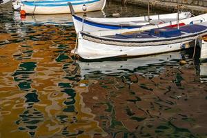 Camogli houses reflection in the harbor water sea photo