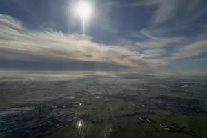 fog and clouds amsterdam area aerial view photo