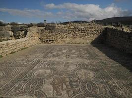 mosaic in Volubilis Roman ruins in Morocco- Best-preserved Roman ruins located between the Imperial Cities of Fez and Meknes photo