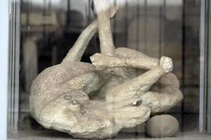 NAPLES, ITALY - FEBRUARY 1 2020 - pompei ruins statue buried corpse photo