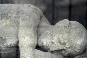 NAPLES, ITALY - FEBRUARY 1 2020 - pompei ruins statue buried corpse photo
