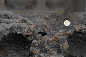 pompei ruins houses full of tourist coins photo