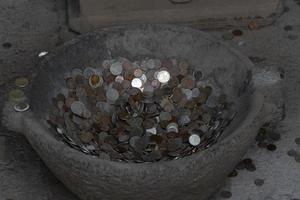 pompei ruins houses full of tourist coins photo