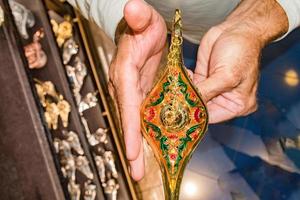 hands rubbing on alladin lamp photo