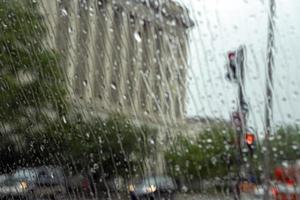 rain on car glass window in washington dc photo