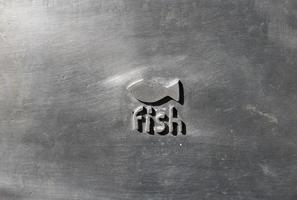 fish writing on silver background photo