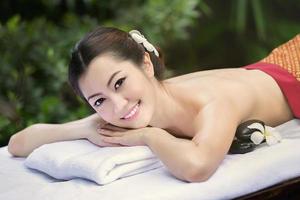 Beautiful Asian girl and spa photo