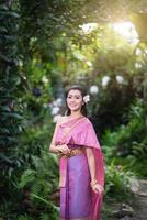 Beautiful Thai girl in Thai traditional costume photo