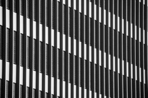 grayscale shot of a facade of modern building photo