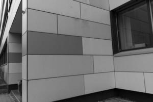 grayscale shot of a facade of modern building photo