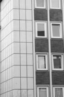 grayscale shot of a facade of modern building photo