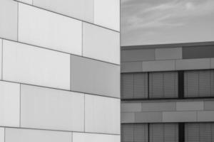 grayscale shot of a facade of modern building photo