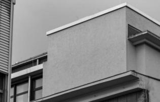 grayscale shot of a facade of modern building photo