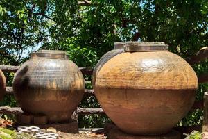 Ancient water jar is a pottery for water. In the past, it was molded with clay and burned to make ceramic as decorations and home decorations and has many uses. photo