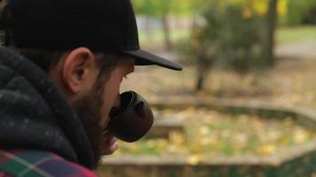 bearded guy sniffs tea from a clay teapot video