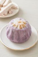 taro bun with white sugar cream and nut photo