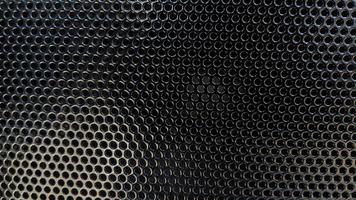 black metal dot grilled pattern. black metal wall texture photo