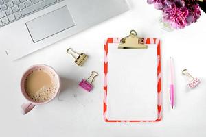 Flat lay feminine home office photo