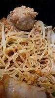 Macro, close up egg noodle with pork meat ball Thai style, delicious, signature, local food, only in Thailand photo