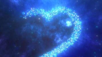 gloeiend blauw liefde hart gemaakt van deeltjes Aan een blauw feestelijk achtergrond voor Valentijnsdag dag. video 4k, beweging ontwerp