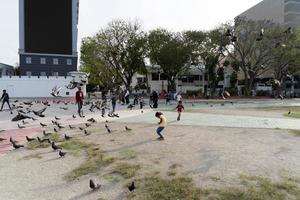 MALE, MALDIVES - FEBRUARY 16 2019 - People and children in island main place before evening pray time photo