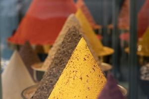 many different spices for sale at the market photo