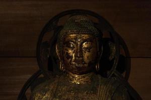 Japanese Buddah statue isolated close up photo