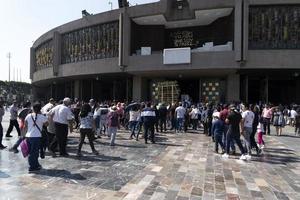 MEXICO CITY, MEXICO - JANUARY 30 2019 - Pilgrims at Guadalupe Cathedral photo