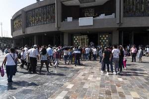 MEXICO CITY, MEXICO - JANUARY 30 2019 - Pilgrims at Guadalupe Cathedral photo