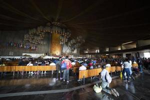 MEXICO CITY, MEXICO - JANUARY 30 2019 - Pilgrims at Guadalupe Cathedral photo