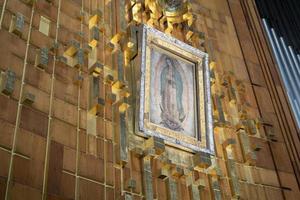 MEXICO CITY, MEXICO - JANUARY 30 2019 - Pilgrims at Guadalupe Cathedral photo