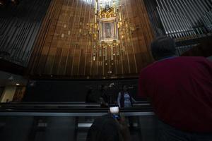 MEXICO CITY, MEXICO - JANUARY 30 2019 - Pilgrims at Guadalupe Cathedral photo