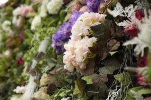 Dry flowers. Wall of roses. Texture floral decoration. Bright bouquet. photo