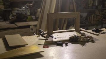 Carpentry workshop in detail. Interior of wood workshop. Items on table. photo