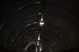 Tunnel at night. Details of architecture in dark. photo