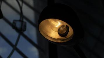 Table lamp in room. Light on table. Old type incandescent lamp. photo