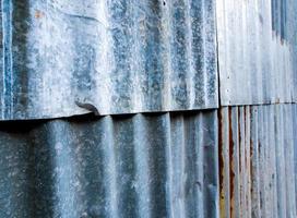 Rusty corrugated galvanized sheet iron fence photo
