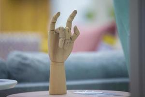 Wooden model of a human hand.Faux fingers photo