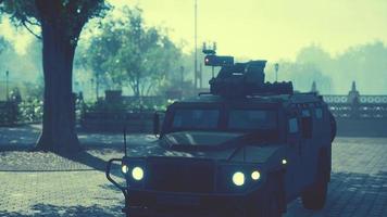 armored military car in big city photo