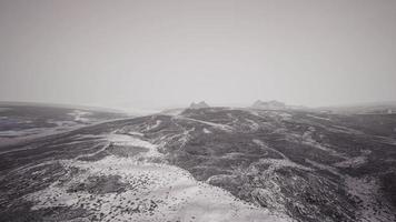 Dramatic winter dark desert steppe on a highland mountain plateau photo