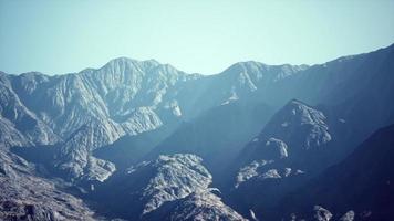 View of the Afghan mountains in fog photo