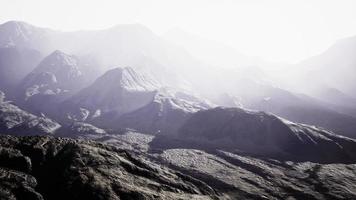 View of the Afghan mountains in fog photo