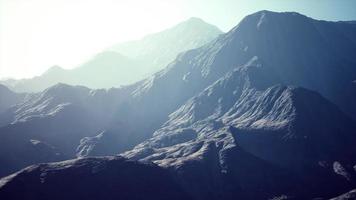 View of the Afghan mountains in fog photo