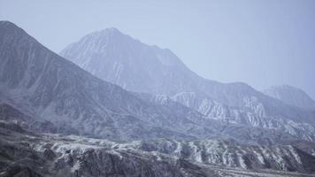 View of the Afghan mountains in fog photo